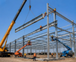 Real steel structure installation site with crane and workers for Australia prefab steel warehouse planning