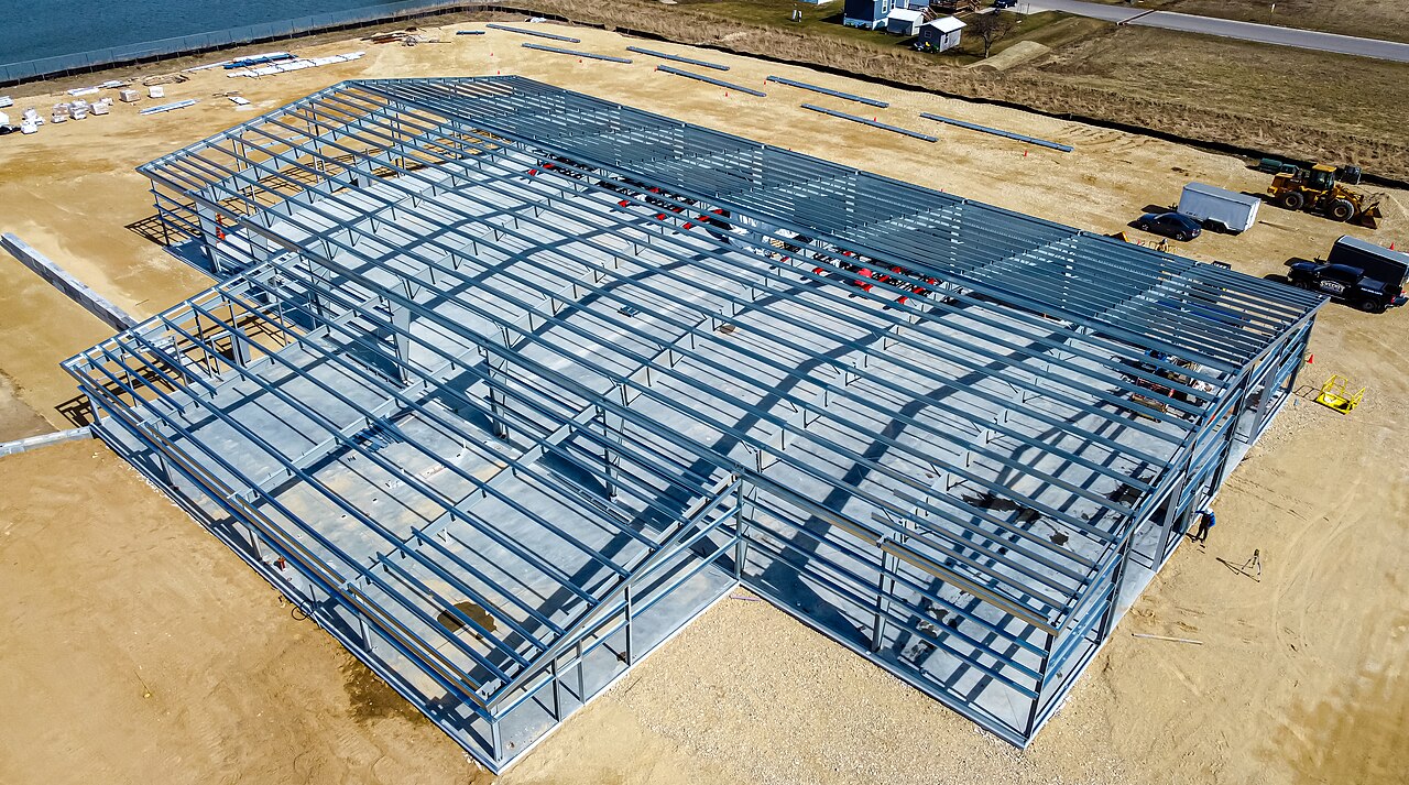 Prefab steel warehouse frame under construction in Bahrain industrial zone