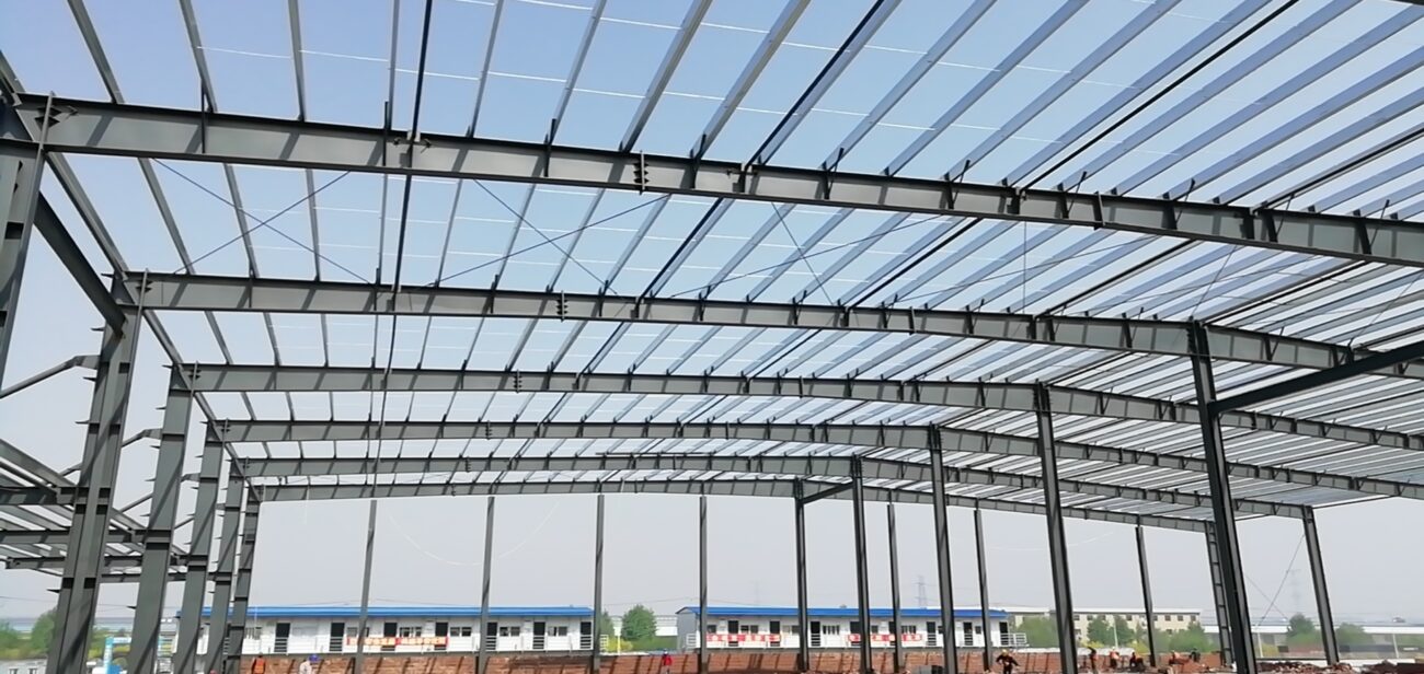 Prefab steel portal frame warehouse under construction in Qatar