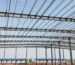 Prefab steel portal frame warehouse under construction in Qatar