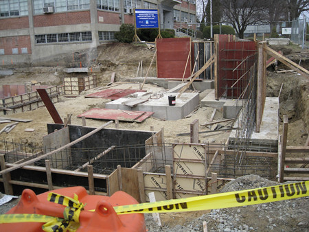 Real building foundation construction with formwork and reinforced concrete preparation