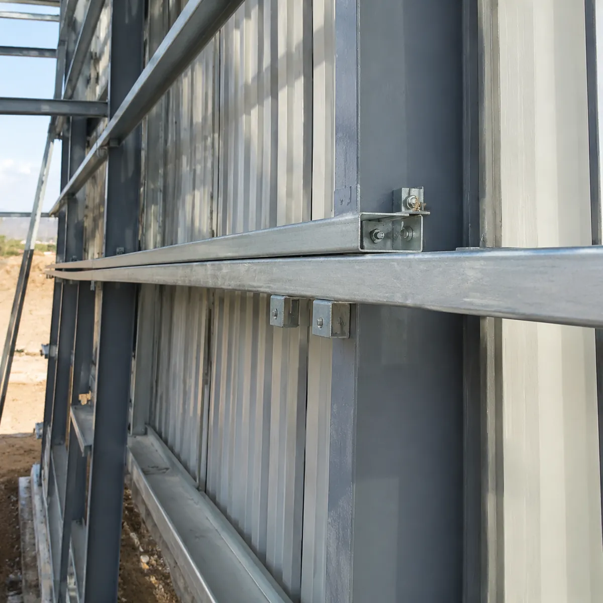 Secondary steel purlins and girts installed on steel frame