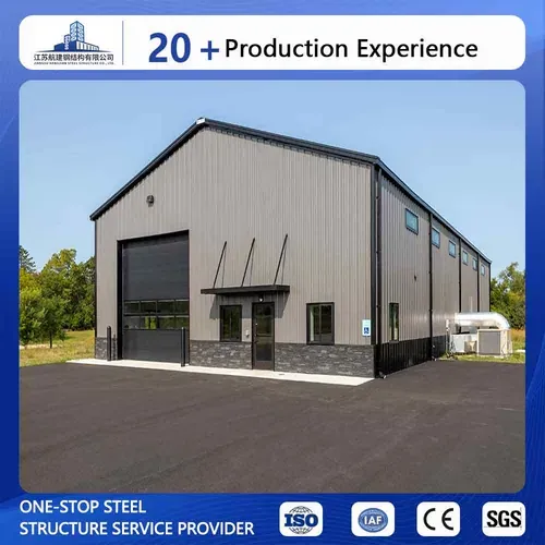 Steel warehouse building exterior inspected for maintenance planning