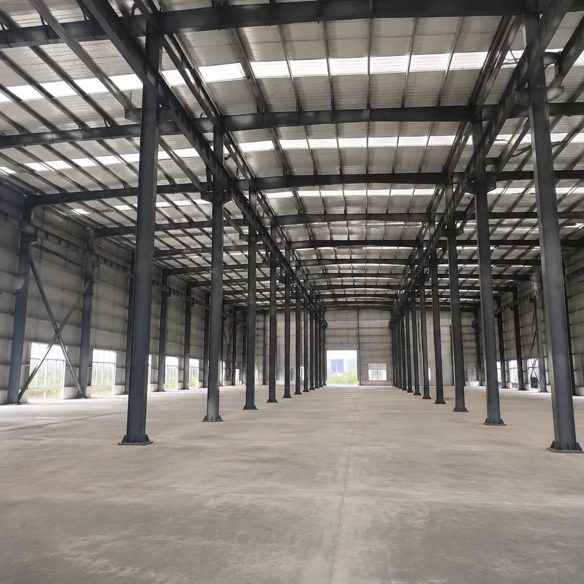 Row of identical steel portal frames in standard bays
