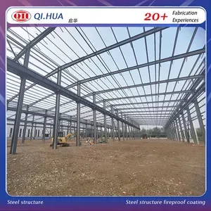 Steel structure factory building with frame and cladding during site preparation