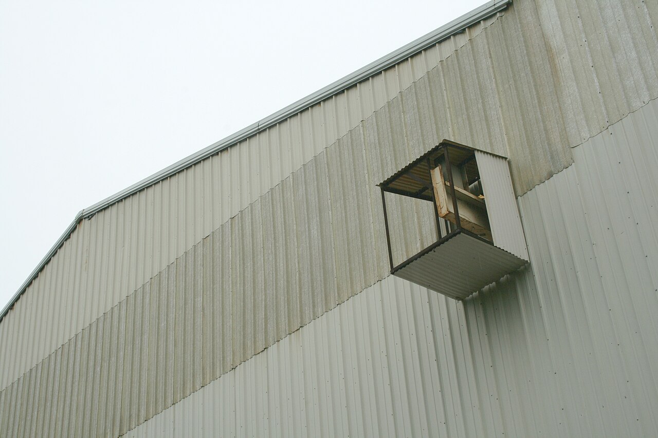 Steel portal frame erection with crane - illustrative