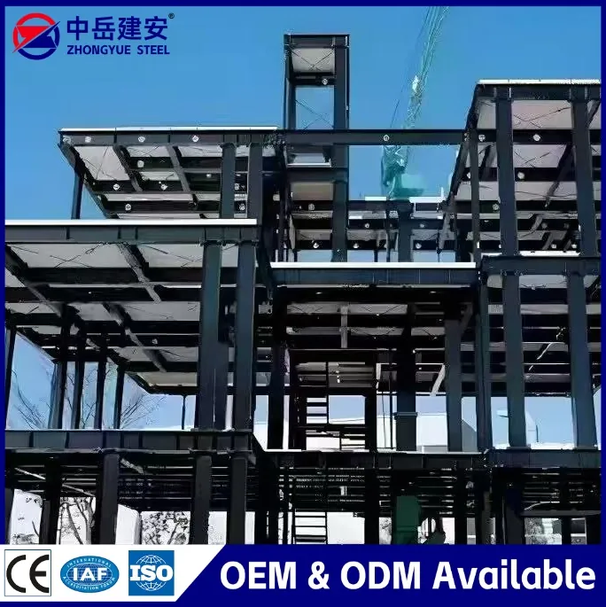 Mobile crane lifting a steel building primary frame during erection