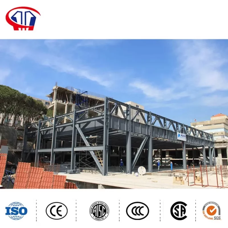 Fabricated steel building frame members stacked for delivery