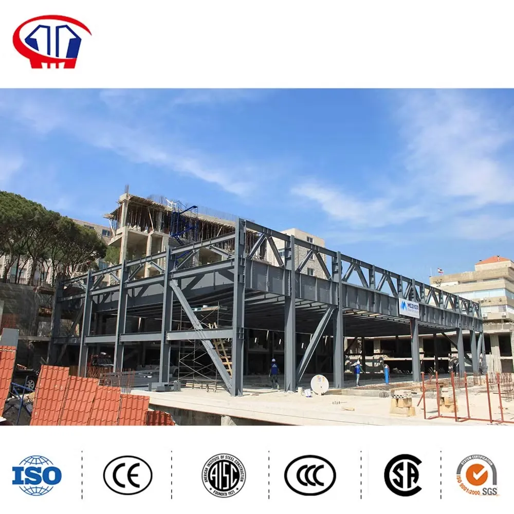 Fabricated steel building frame members stacked for delivery