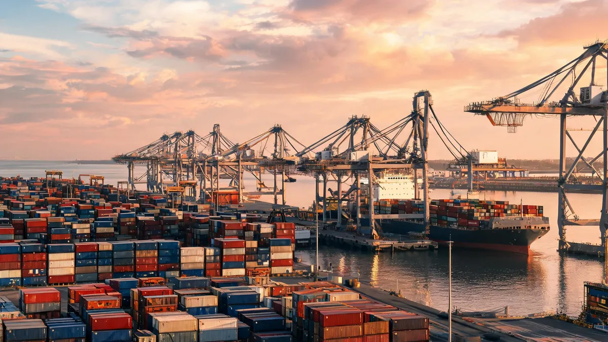 Container port with gantry cranes and a cargo vessel at berth