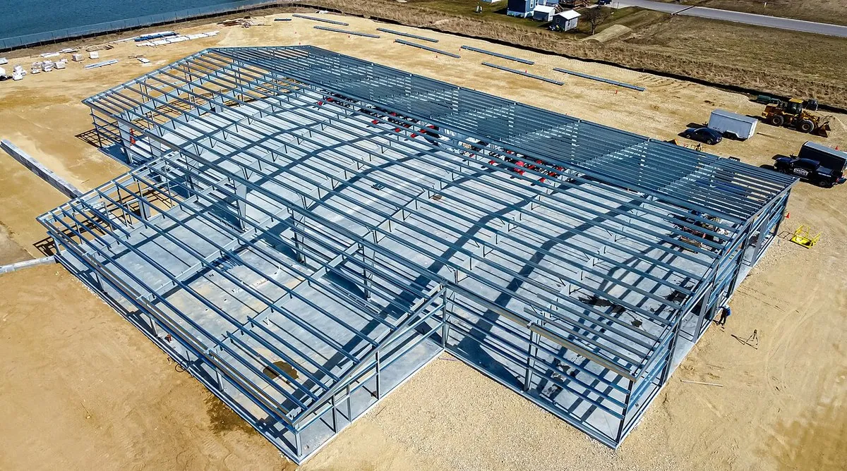 Steel frame structure under construction with columns and roof steel