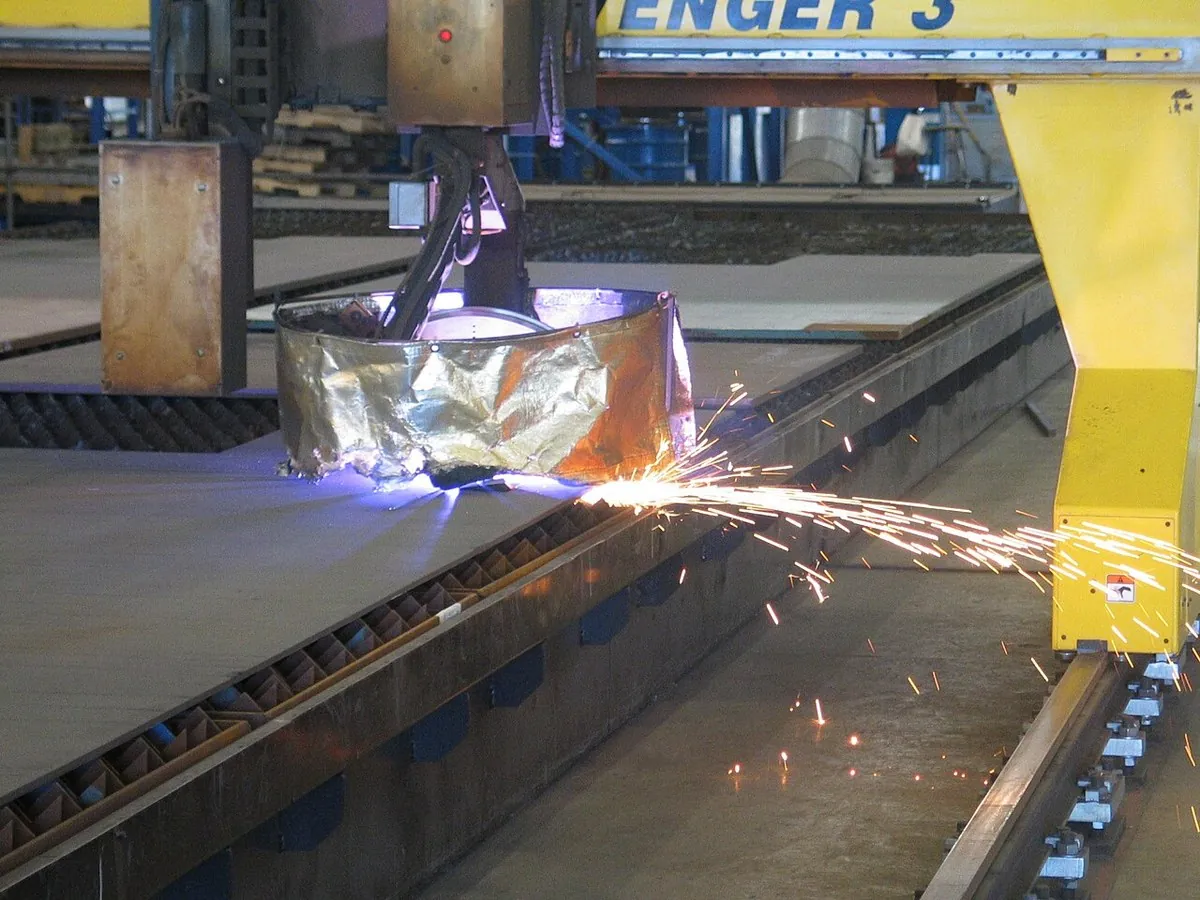 CNC plasma cutting and steel member fabrication lines inside a Chinese steel building manufacturer plant