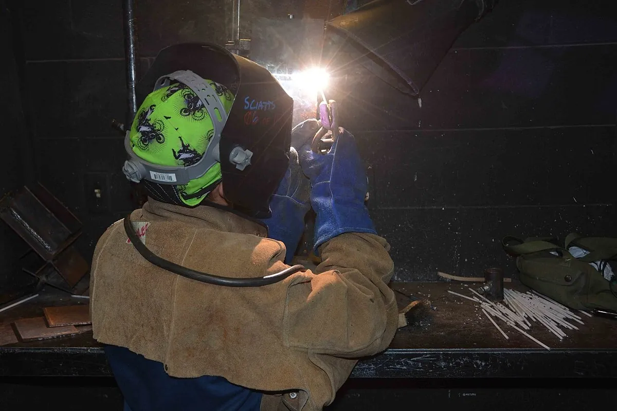 Shot blasting booth and painting line preparing steel members before export