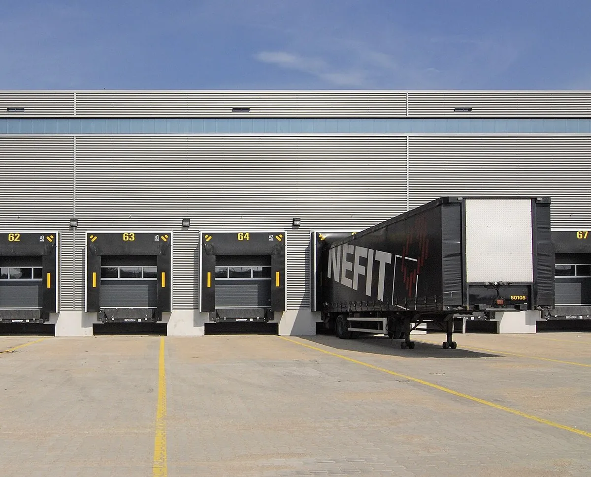Modern warehouse loading dock with dock levellers and sectional doors