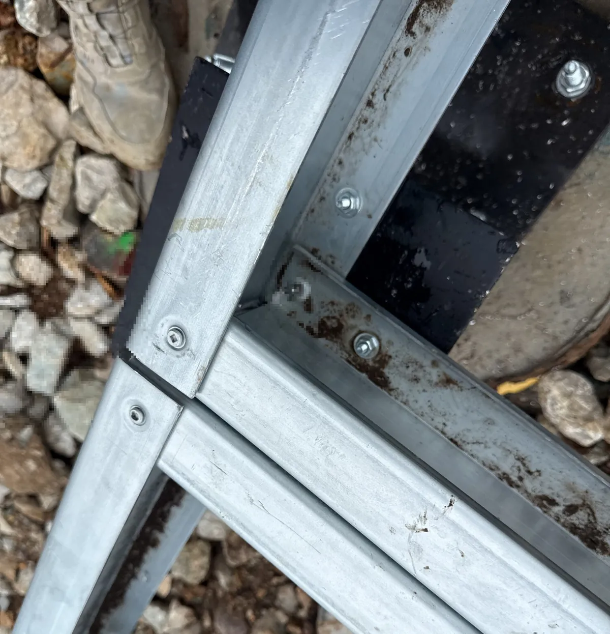 Bolted steel connection detail with end plates and bolts visible between two steel members
